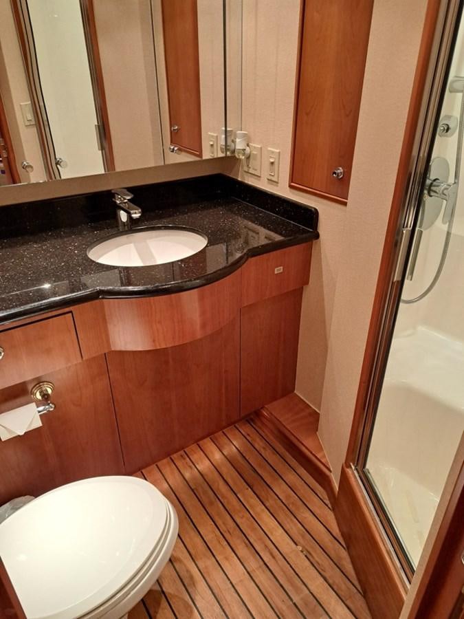 a bathroom with a sink and toilet aboard CLAIRE TOO Yacht for Sale