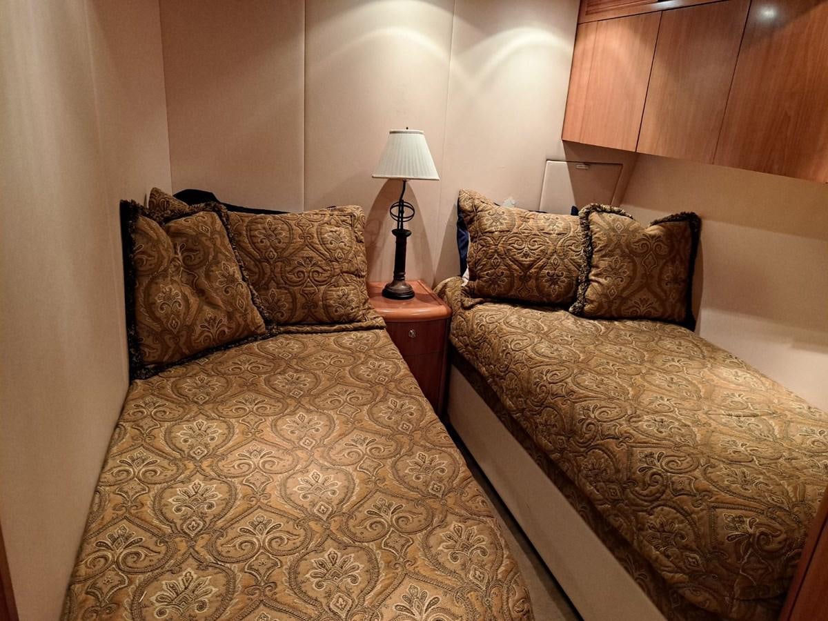 a bed with a lamp on it aboard CLAIRE TOO Yacht for Sale