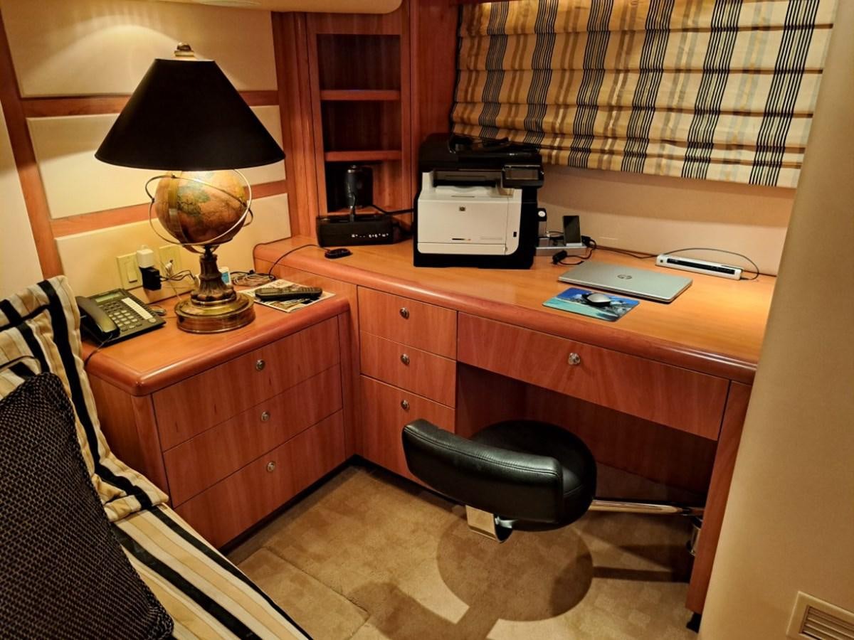 a desk with a lamp and a chair aboard CLAIRE TOO Yacht for Sale