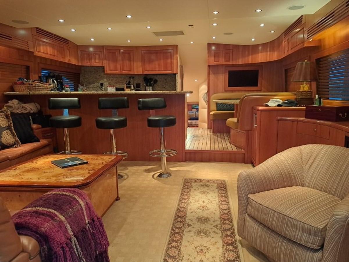 a living room with a couch and a table aboard CLAIRE TOO Yacht for Sale