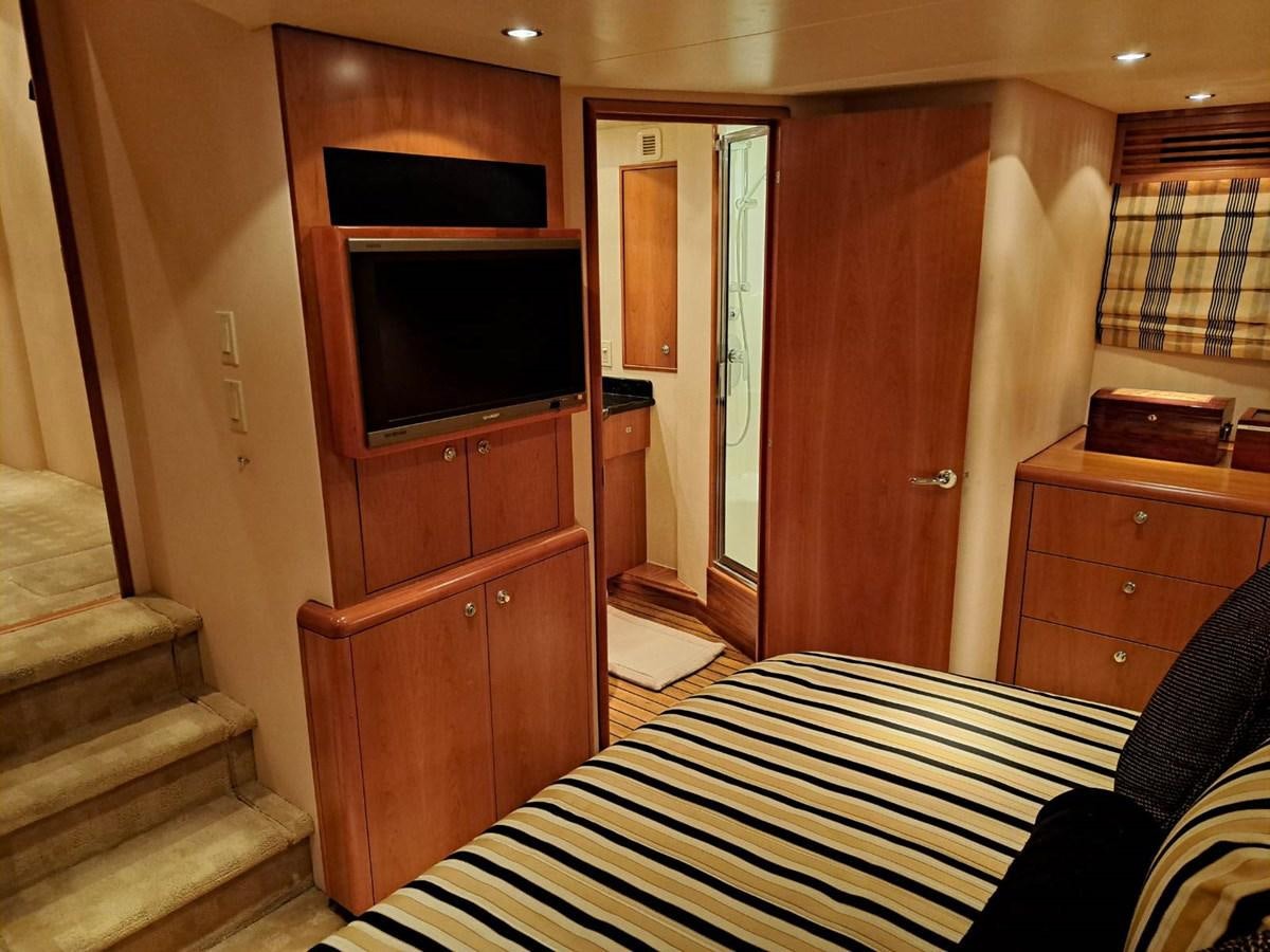a room with a bed and a tv aboard CLAIRE TOO Yacht for Sale