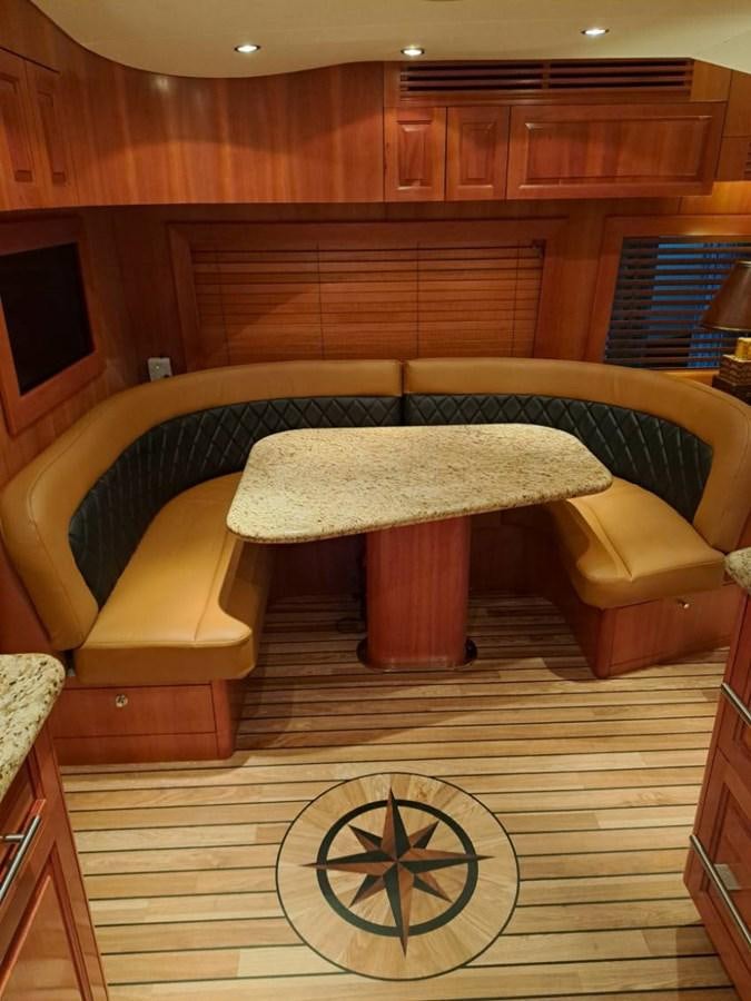 a room with a couch and a table aboard CLAIRE TOO Yacht for Sale