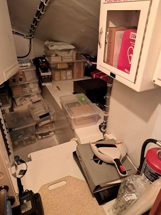 a room with a computer and other objects aboard CLAIRE TOO Yacht for Sale