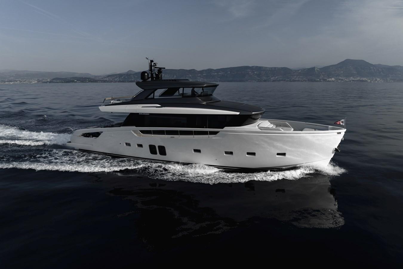 a white boat on the water aboard RADKAT Yacht for Sale