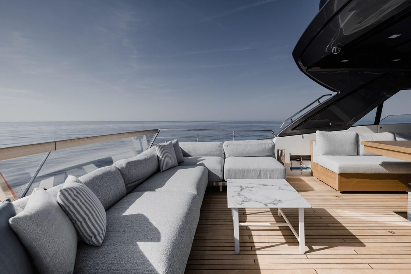 a living room with a piano aboard RADKAT Yacht for Sale