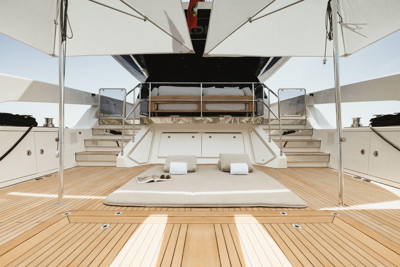 a large room with a large white shelf and a black shelf aboard RADKAT Yacht for Sale