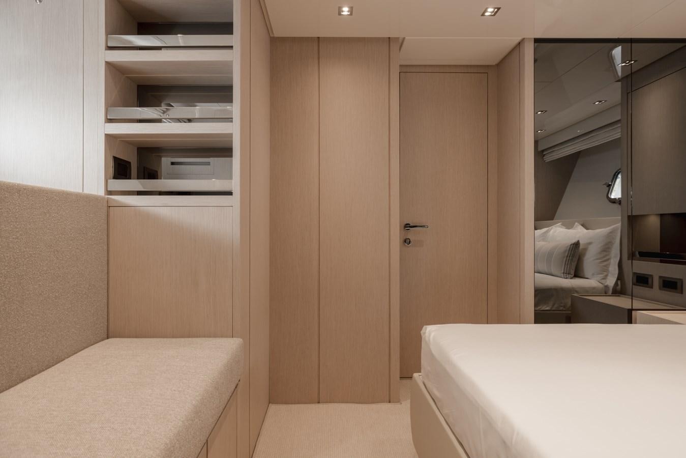 a room with a bed and a closet aboard RADKAT Yacht for Sale