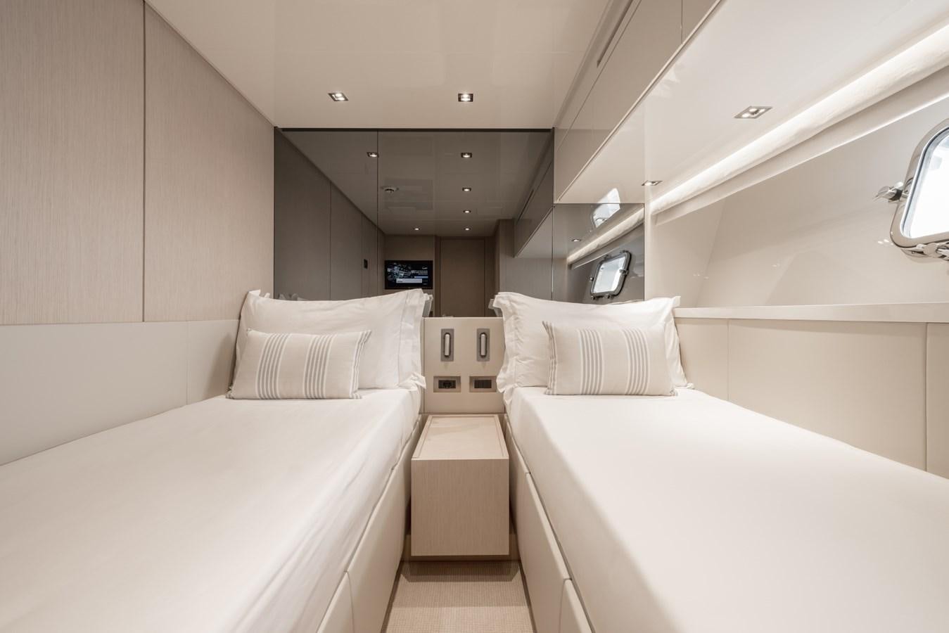 a room with two beds aboard RADKAT Yacht for Sale