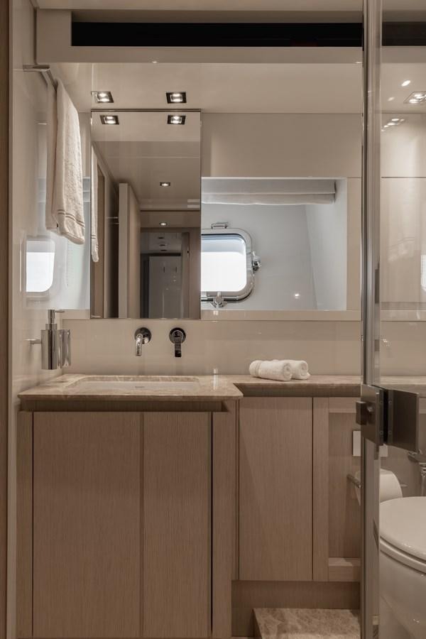 a bathroom with a sink and a mirror aboard RADKAT Yacht for Sale