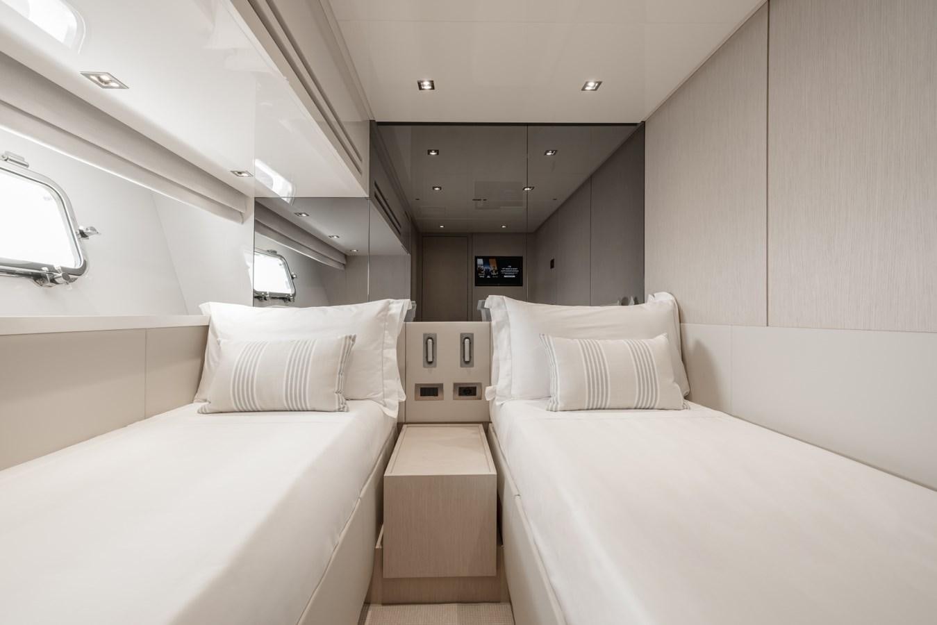 a room with two beds aboard RADKAT Yacht for Sale