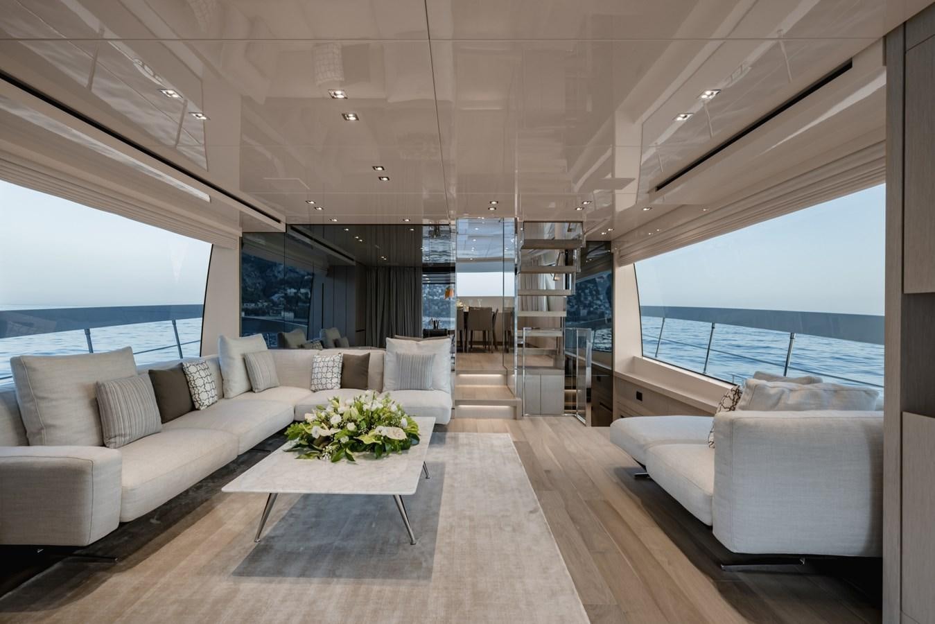 a living room with a large window aboard RADKAT Yacht for Sale