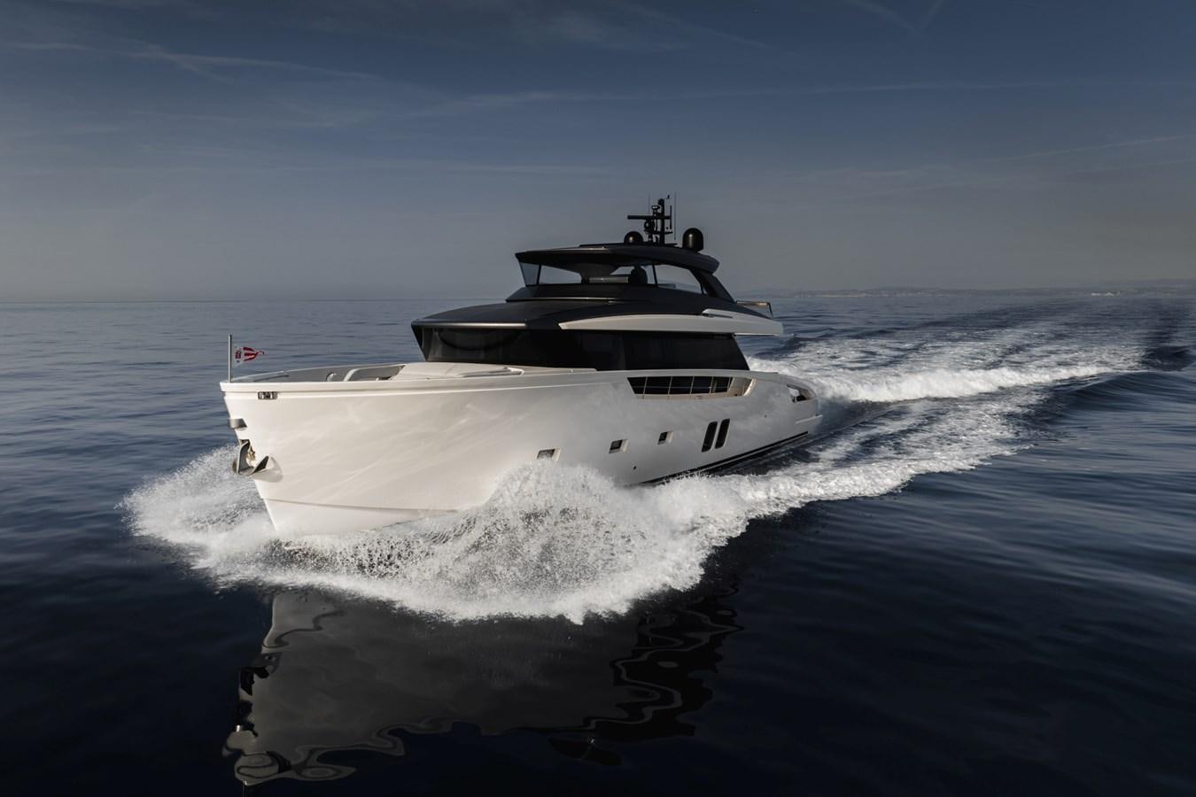 a white boat on the water aboard RADKAT Yacht for Sale