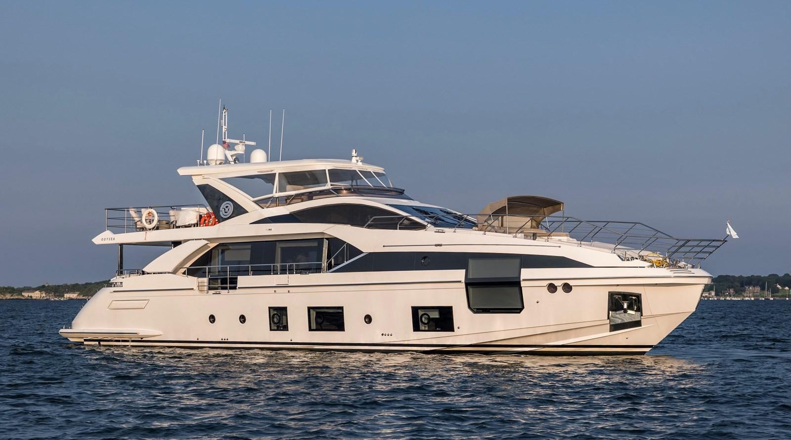 a white yacht on the water aboard ODYSEA Yacht for Sale