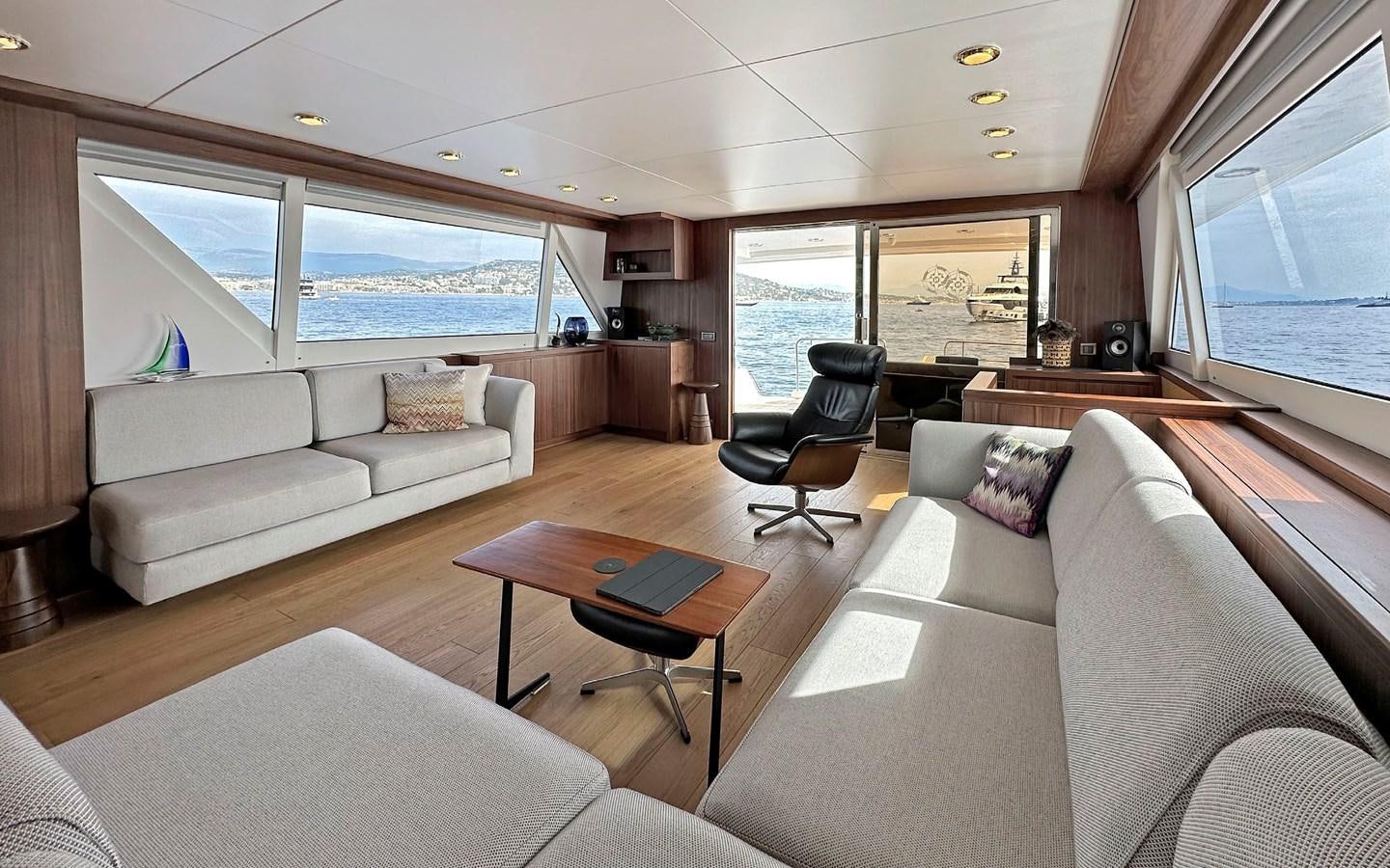 a living room with a large window aboard LORCA Yacht for Sale