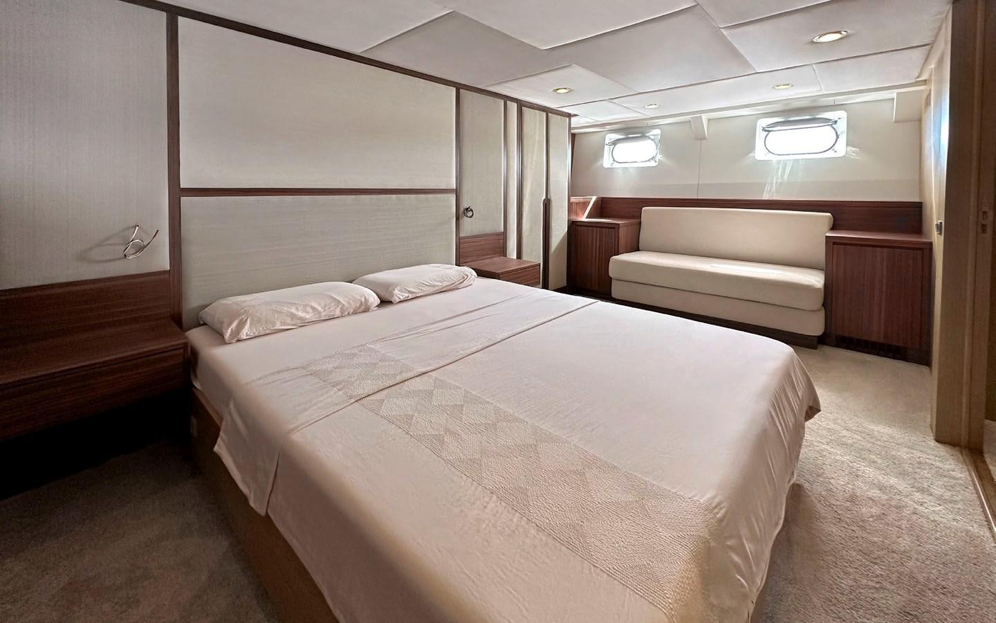 a room with a bed and a couch aboard LORCA Yacht for Sale