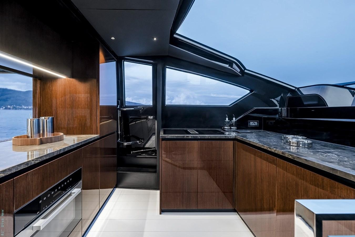 a kitchen with a large window aboard RIVA 82 DIVA Yacht for Sale