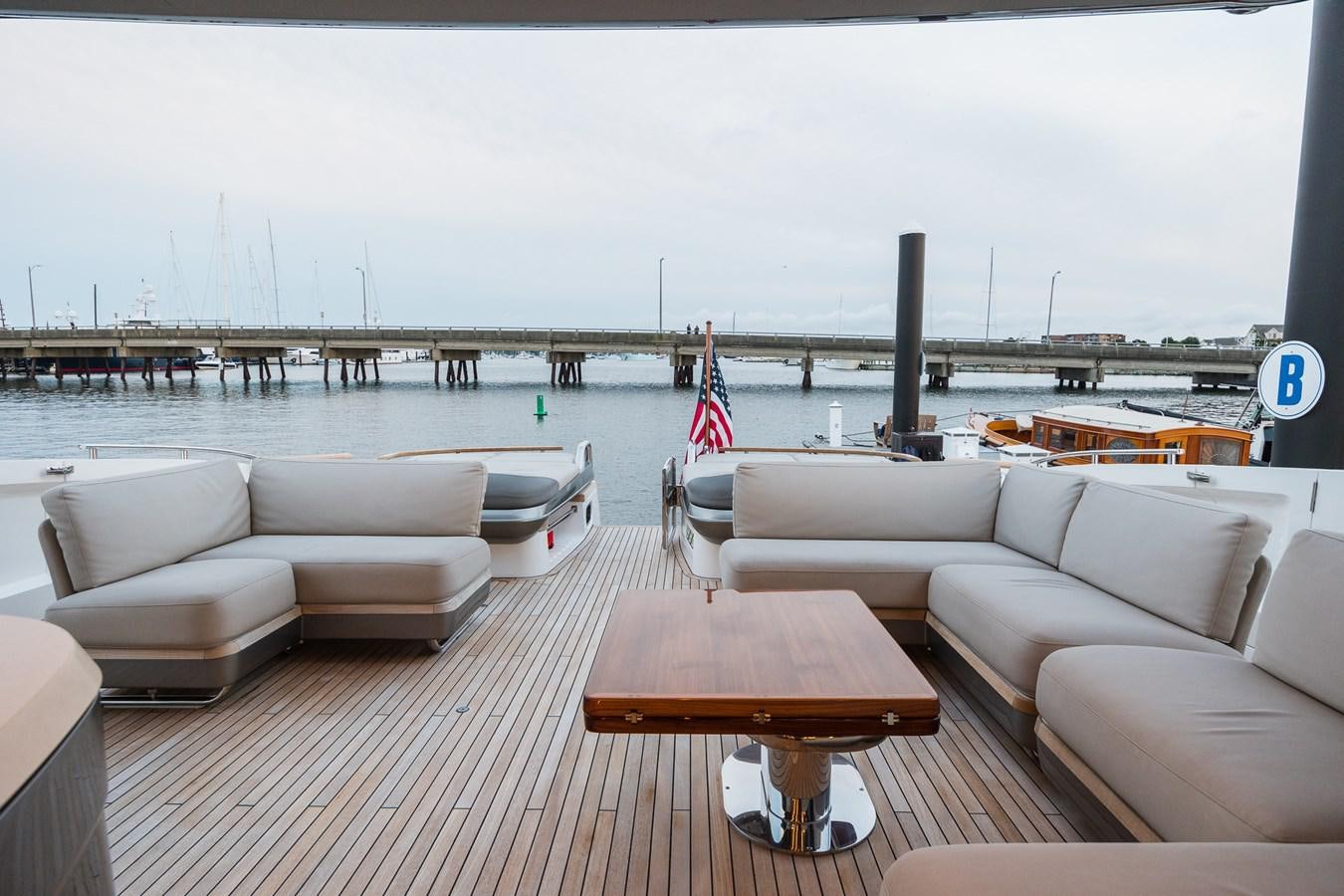 a deck with couches and chairs aboard SPINDRIFT Yacht for Sale