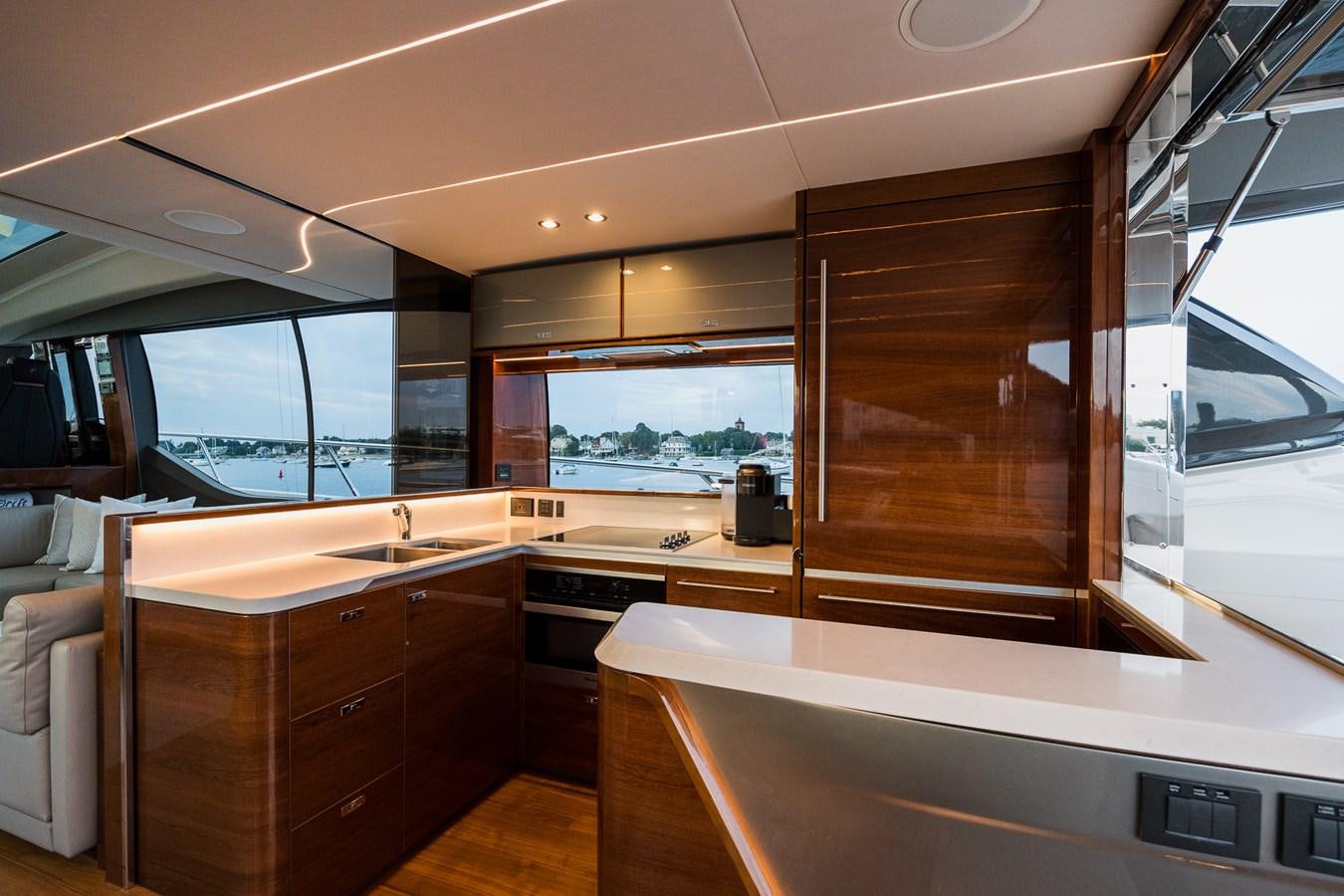a kitchen with wooden cabinets aboard SPINDRIFT Yacht for Sale