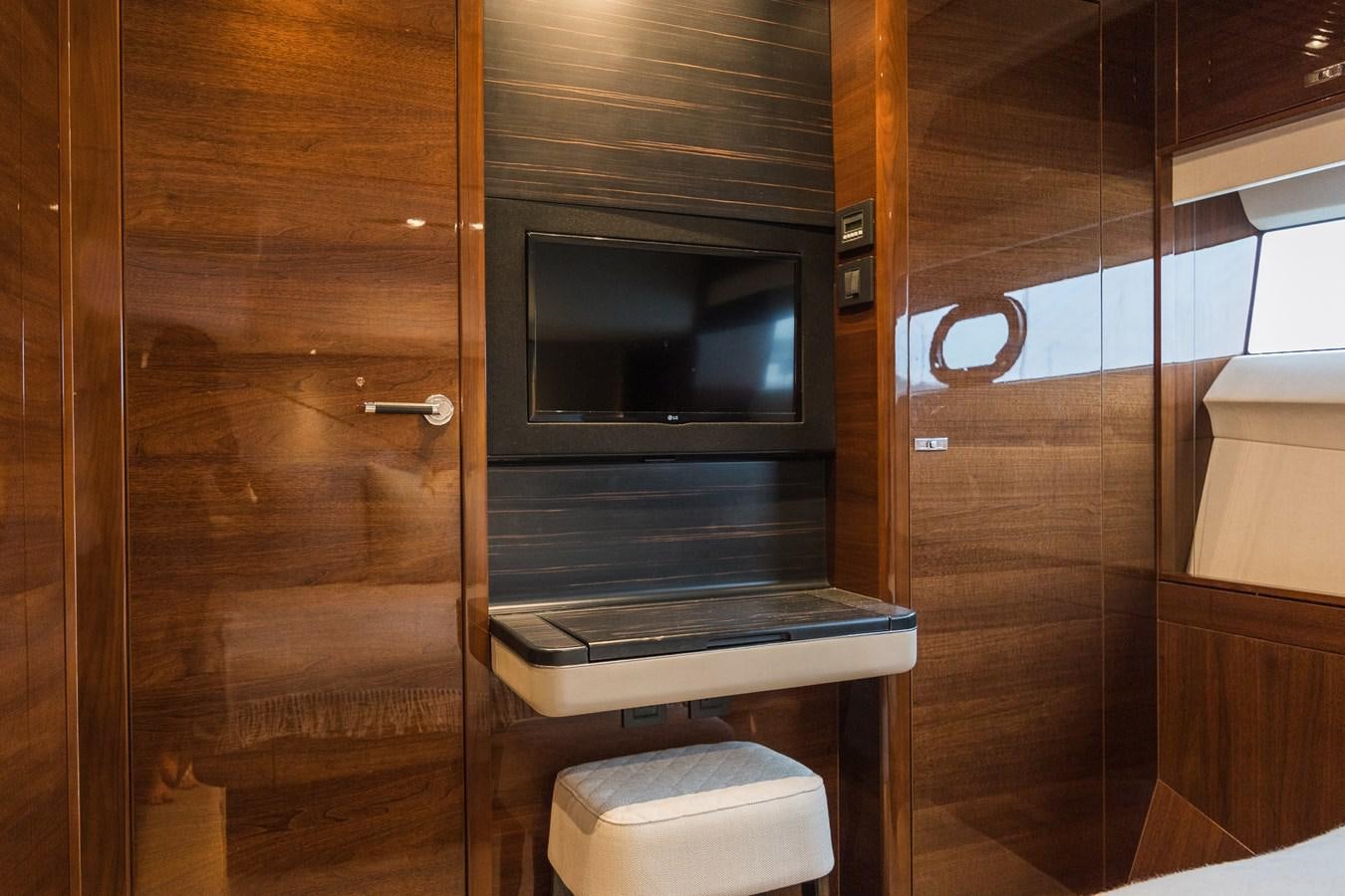 a room with a tv and a toilet aboard SPINDRIFT Yacht for Sale