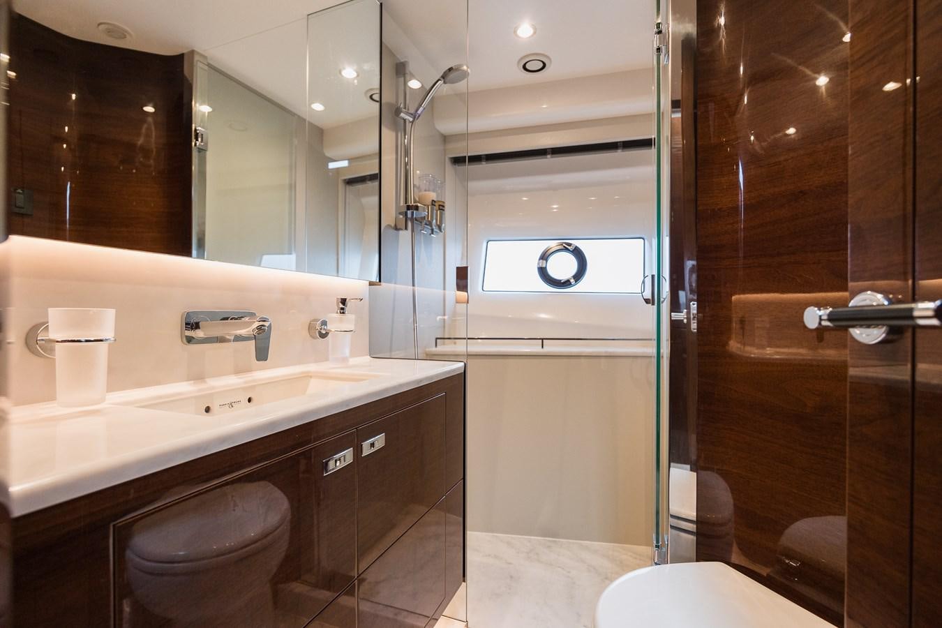 a bathroom with a glass shower aboard SPINDRIFT Yacht for Sale