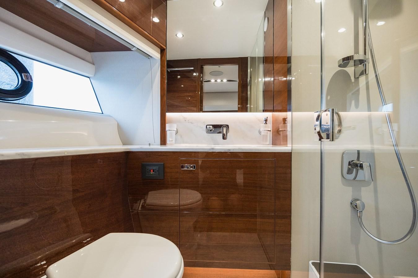 a bathroom with a glass shower aboard SPINDRIFT Yacht for Sale