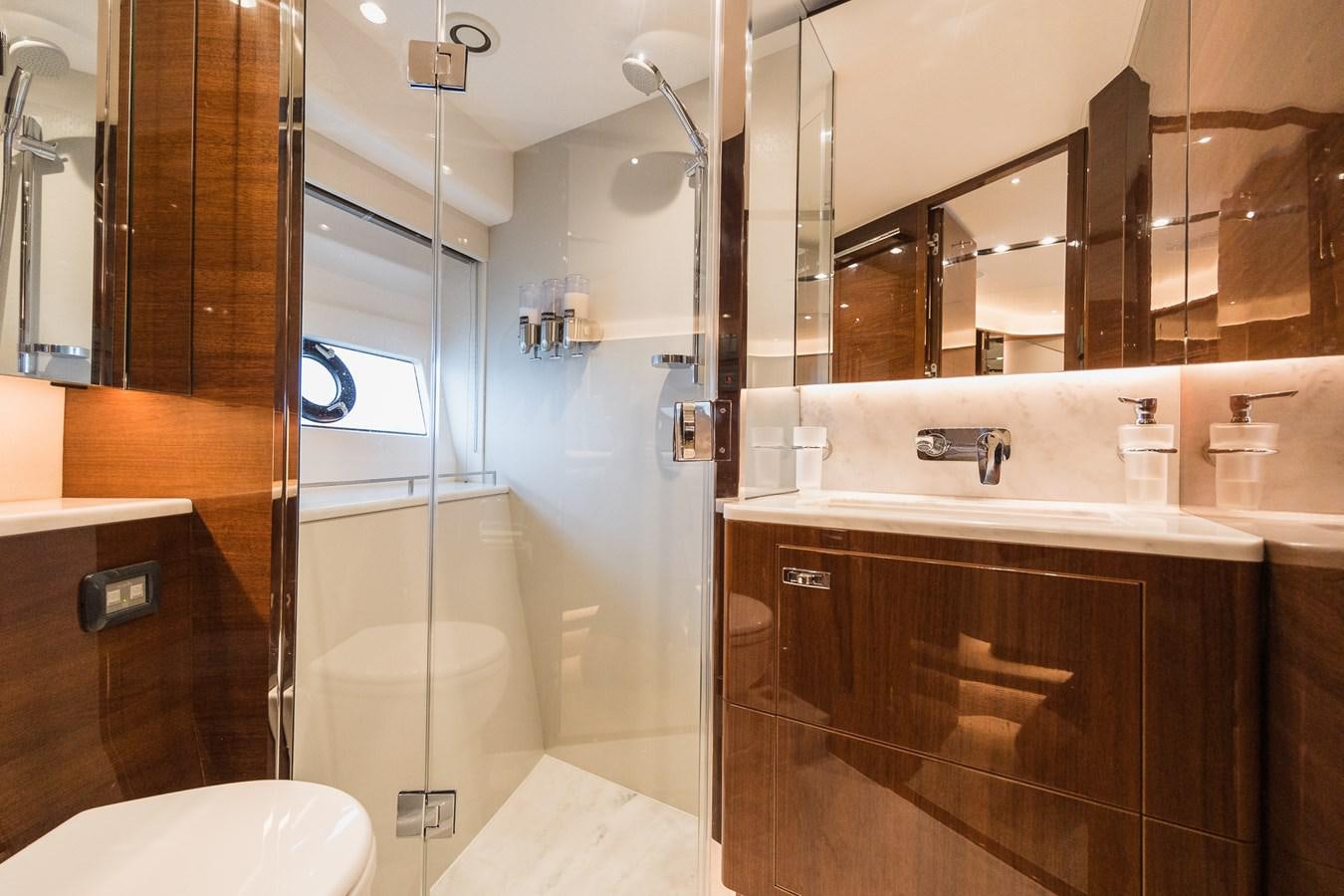 a bathroom with a shower and sink aboard SPINDRIFT Yacht for Sale