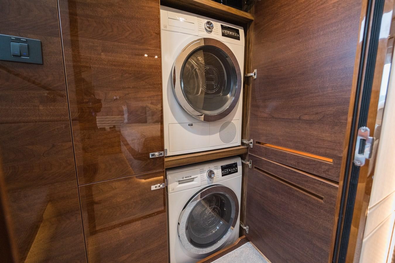 a washer and dryer in a room aboard SPINDRIFT Yacht for Sale