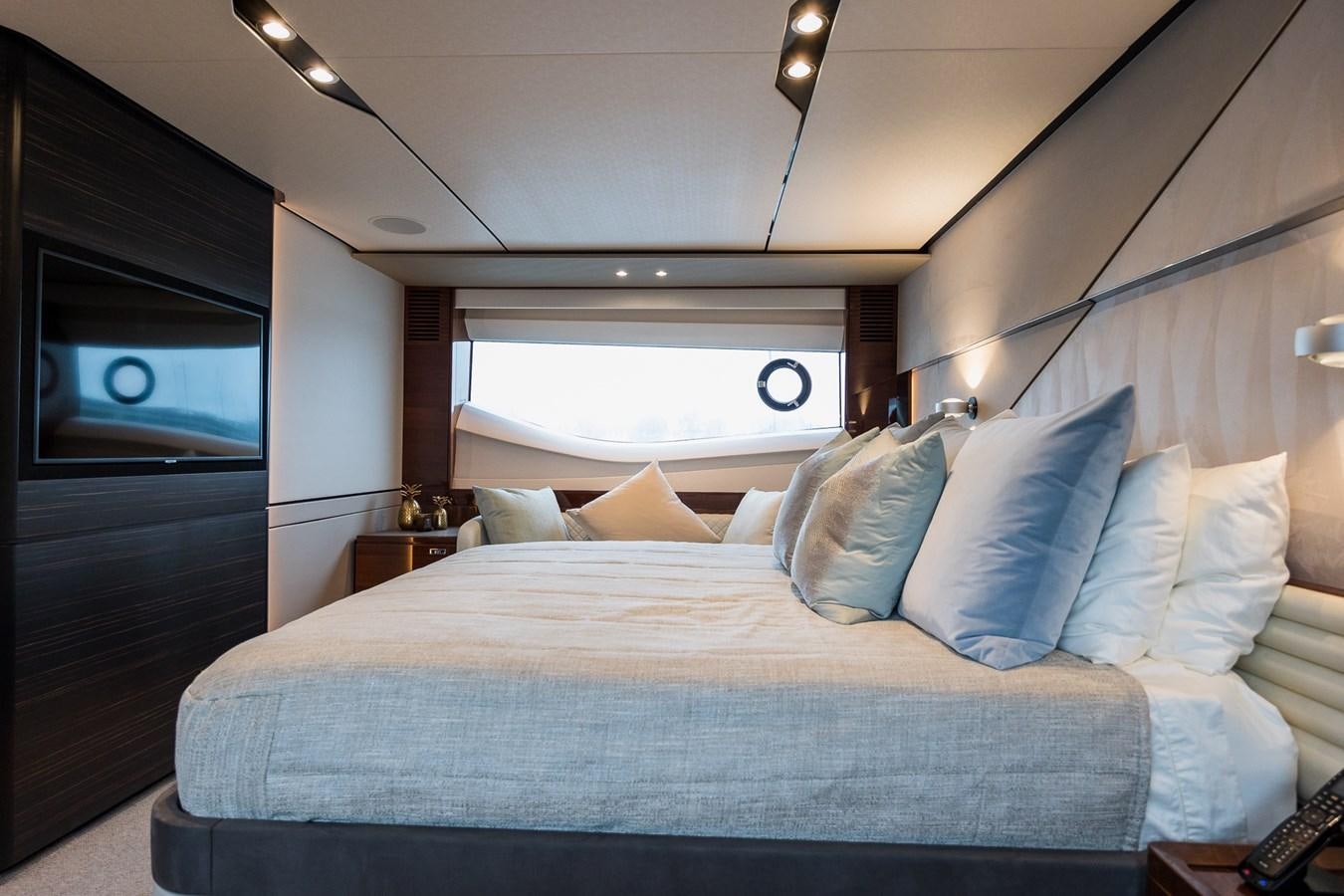 a bed with a blue comforter aboard SPINDRIFT Yacht for Sale