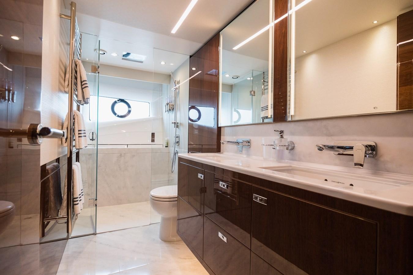a bathroom with a large mirror aboard SPINDRIFT Yacht for Sale