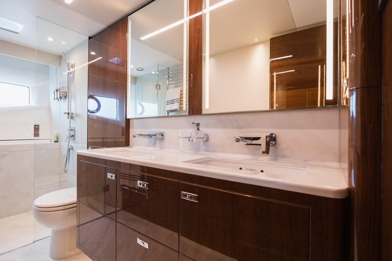 a bathroom with a large mirror aboard SPINDRIFT Yacht for Sale