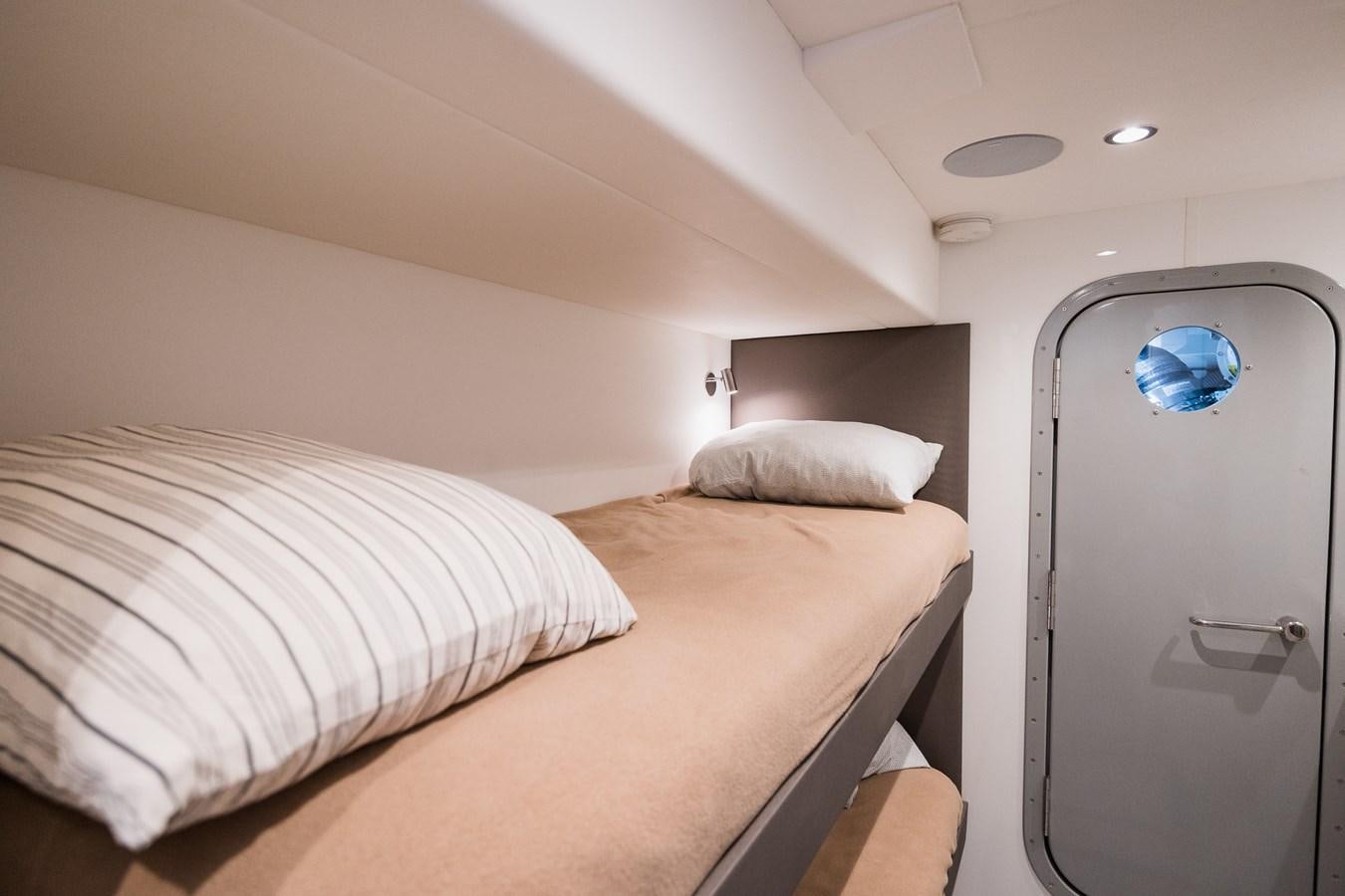 a bed with a white pillow aboard SPINDRIFT Yacht for Sale