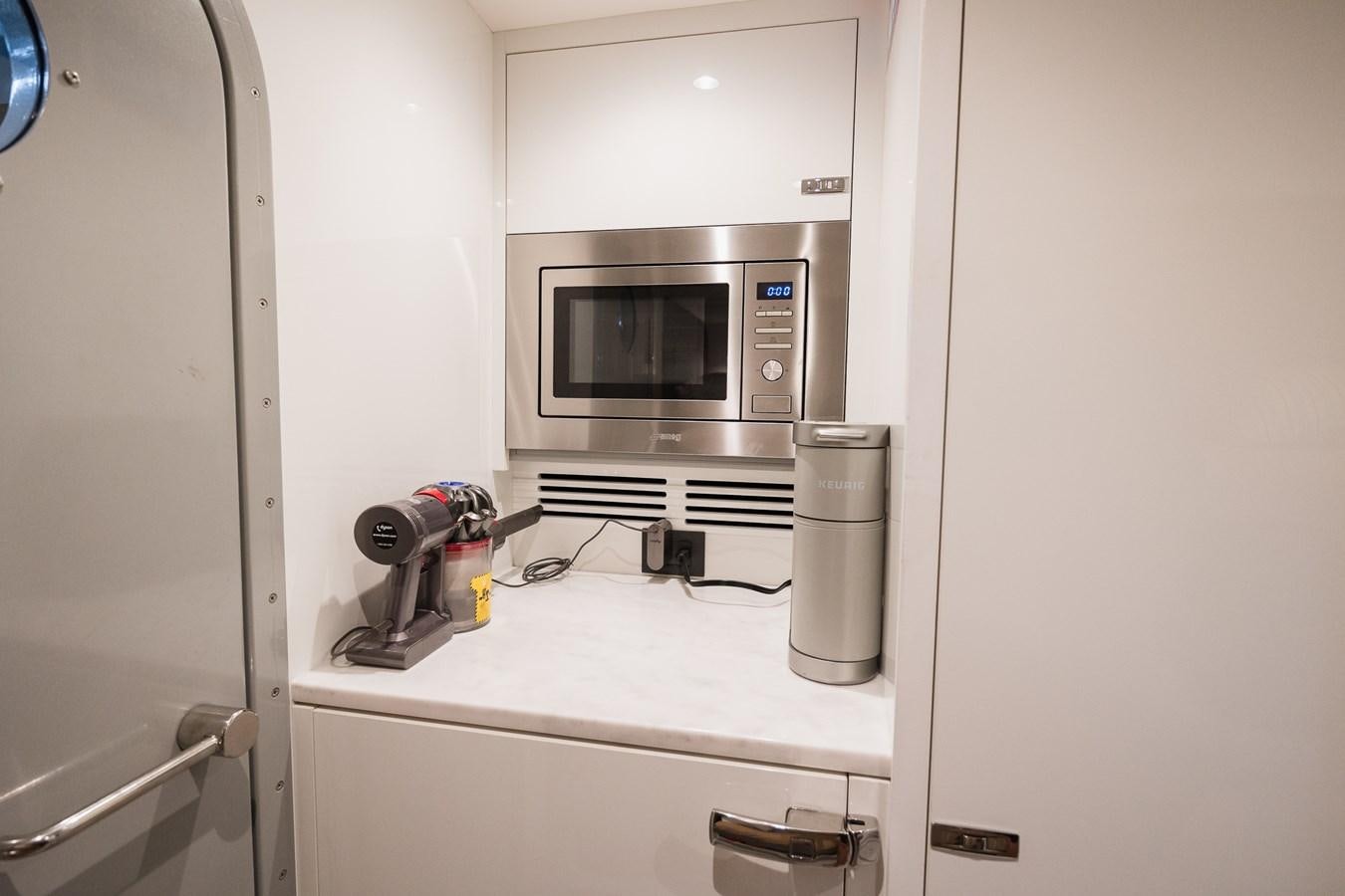 a white microwave oven and a white counter top aboard SPINDRIFT Yacht for Sale