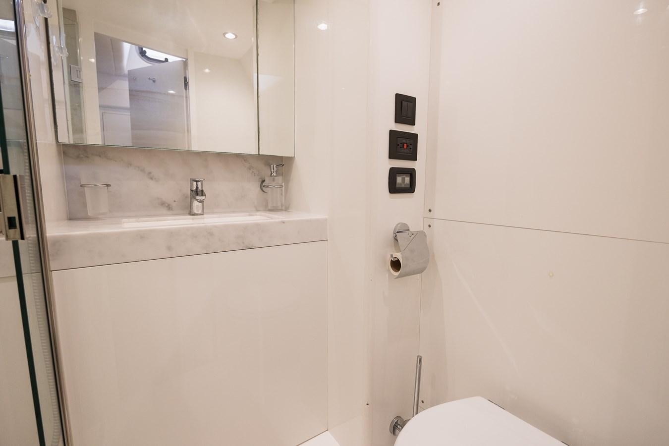 a bathroom with a sink and a mirror aboard SPINDRIFT Yacht for Sale