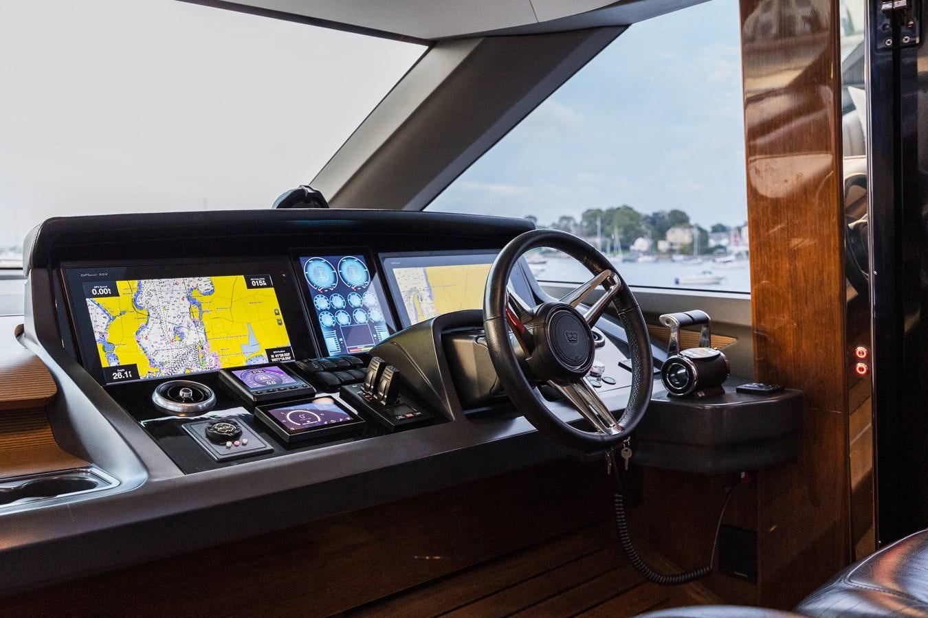 a steering wheel and dashboard of a car aboard SPINDRIFT Yacht for Sale