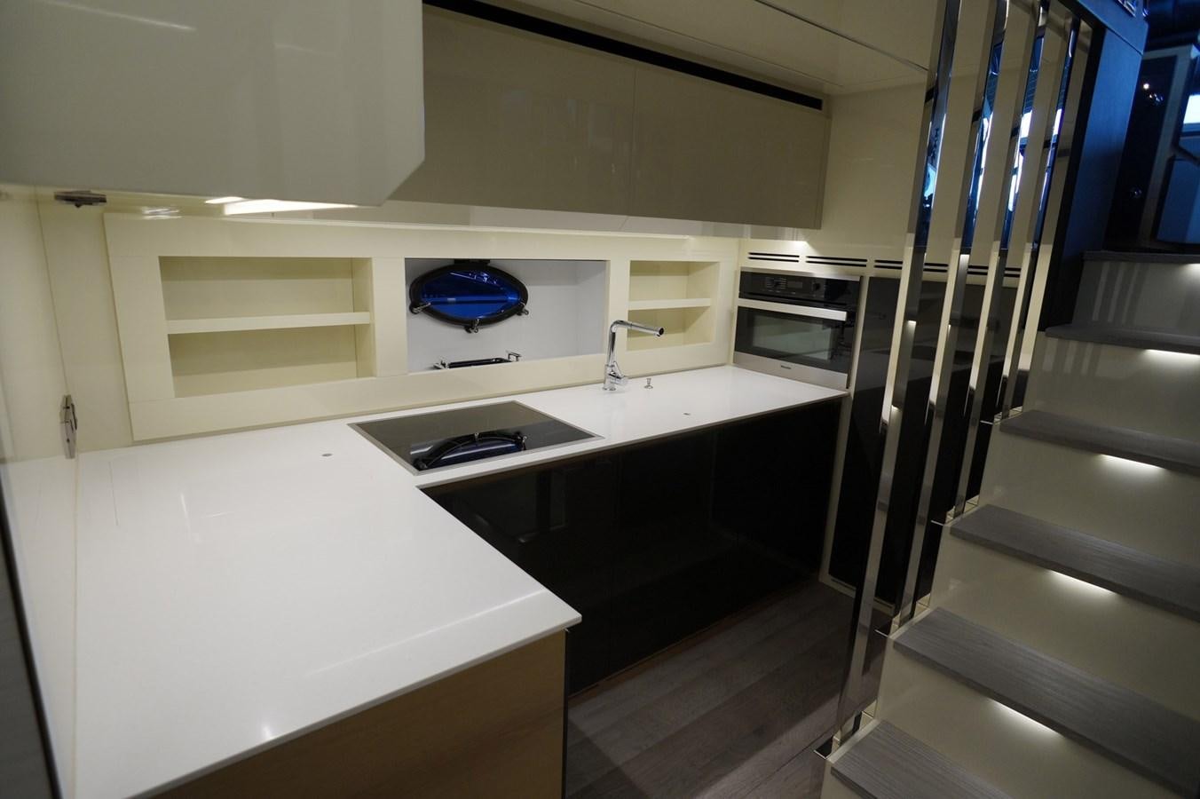 a kitchen with a stove and a sink aboard THE OFFICE Yacht for Sale