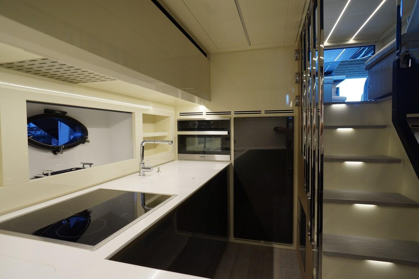 a room with a tv and a sink aboard THE OFFICE Yacht for Sale
