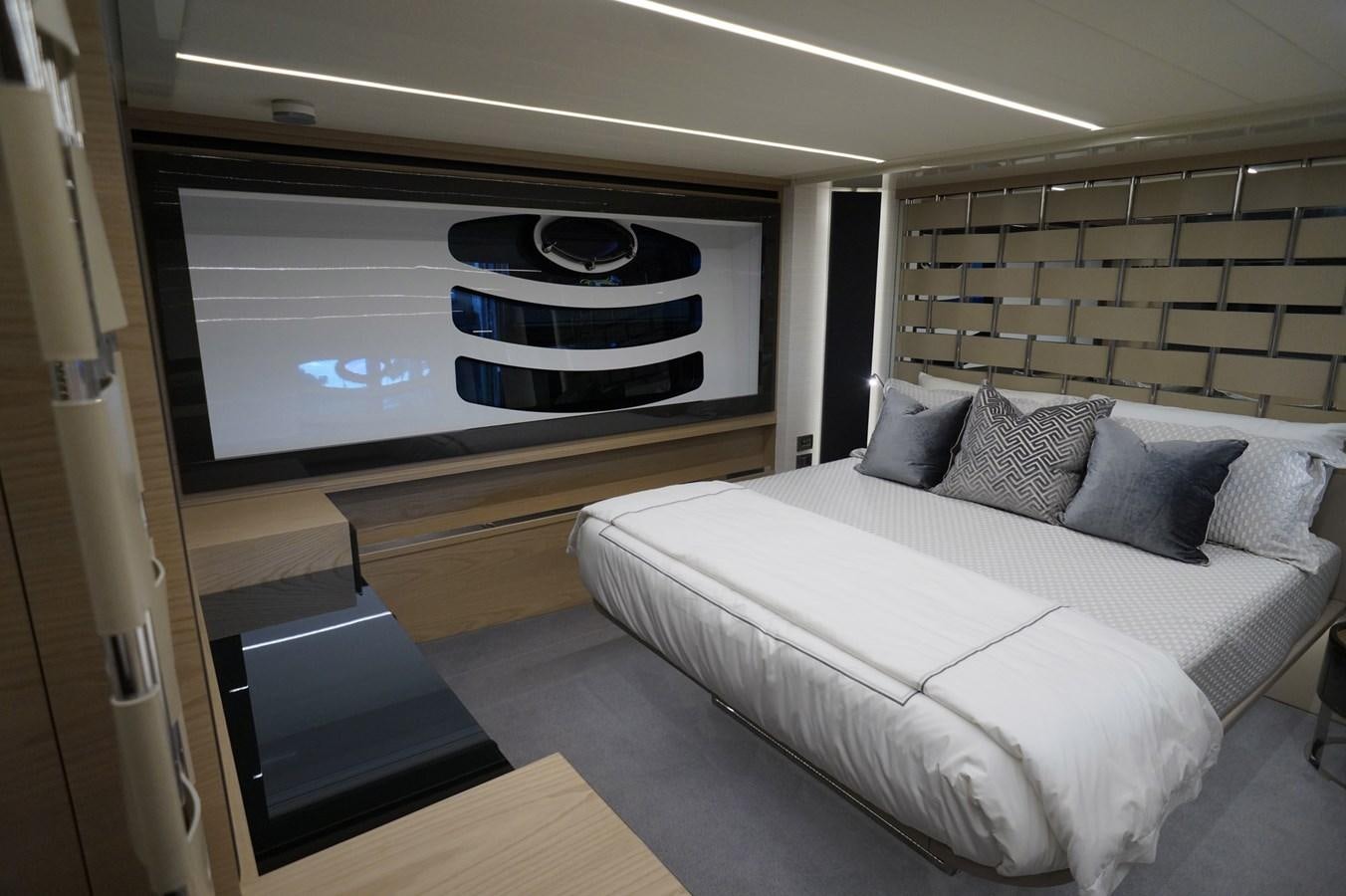 a bed in a room aboard THE OFFICE Yacht for Sale