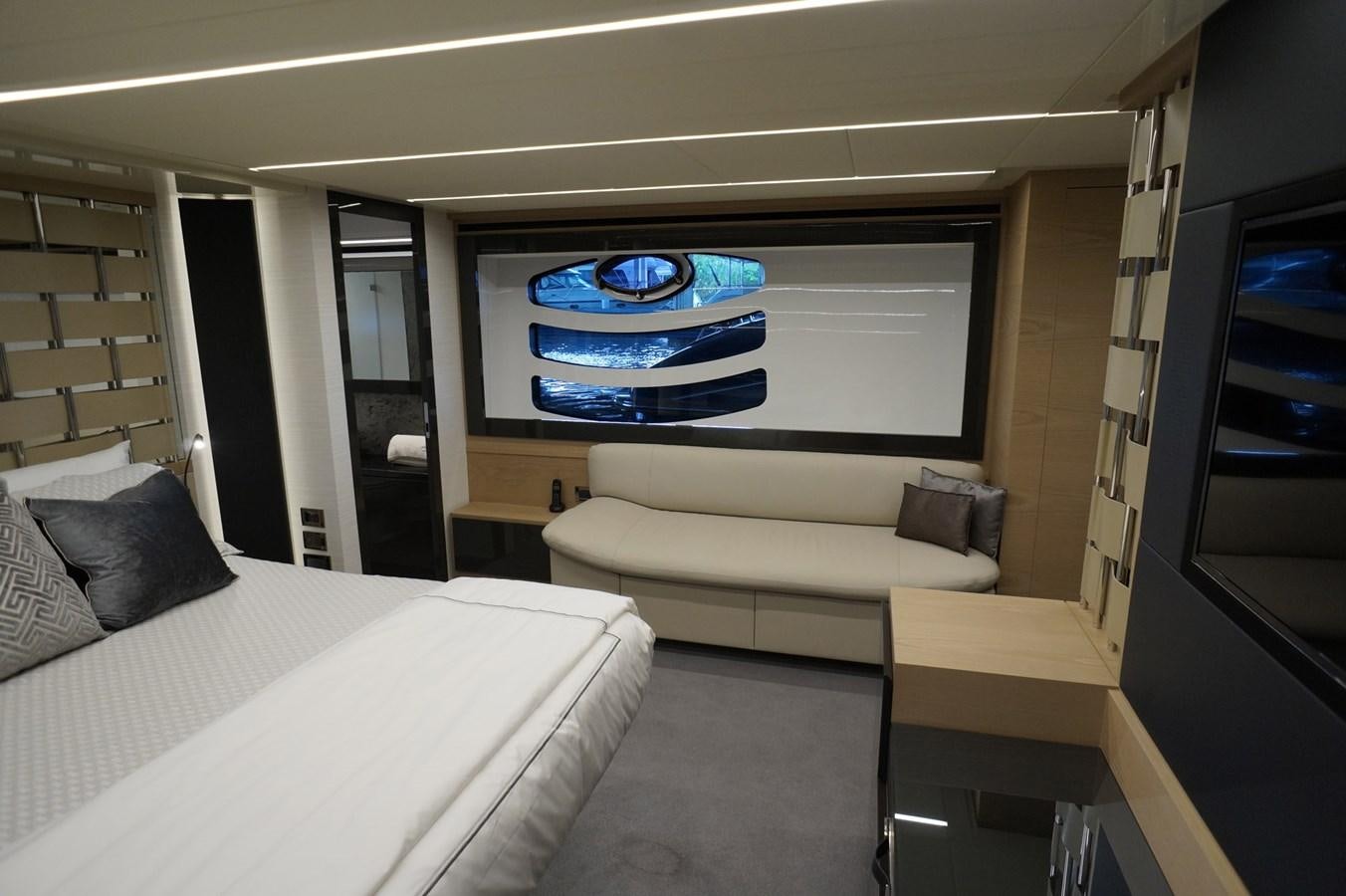 a room with a bed and a tv aboard THE OFFICE Yacht for Sale