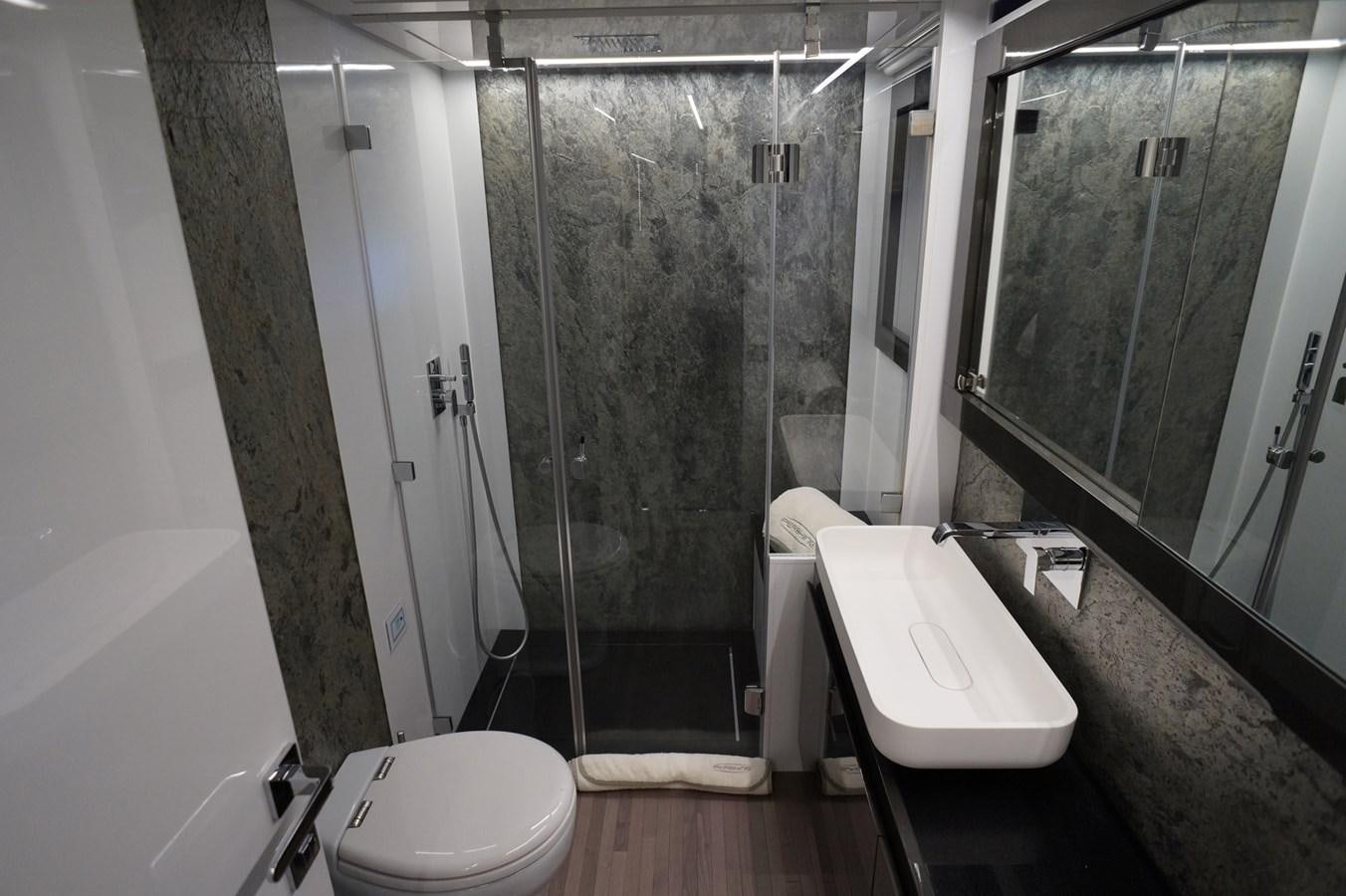 a bathroom with a stand up shower aboard THE OFFICE Yacht for Sale