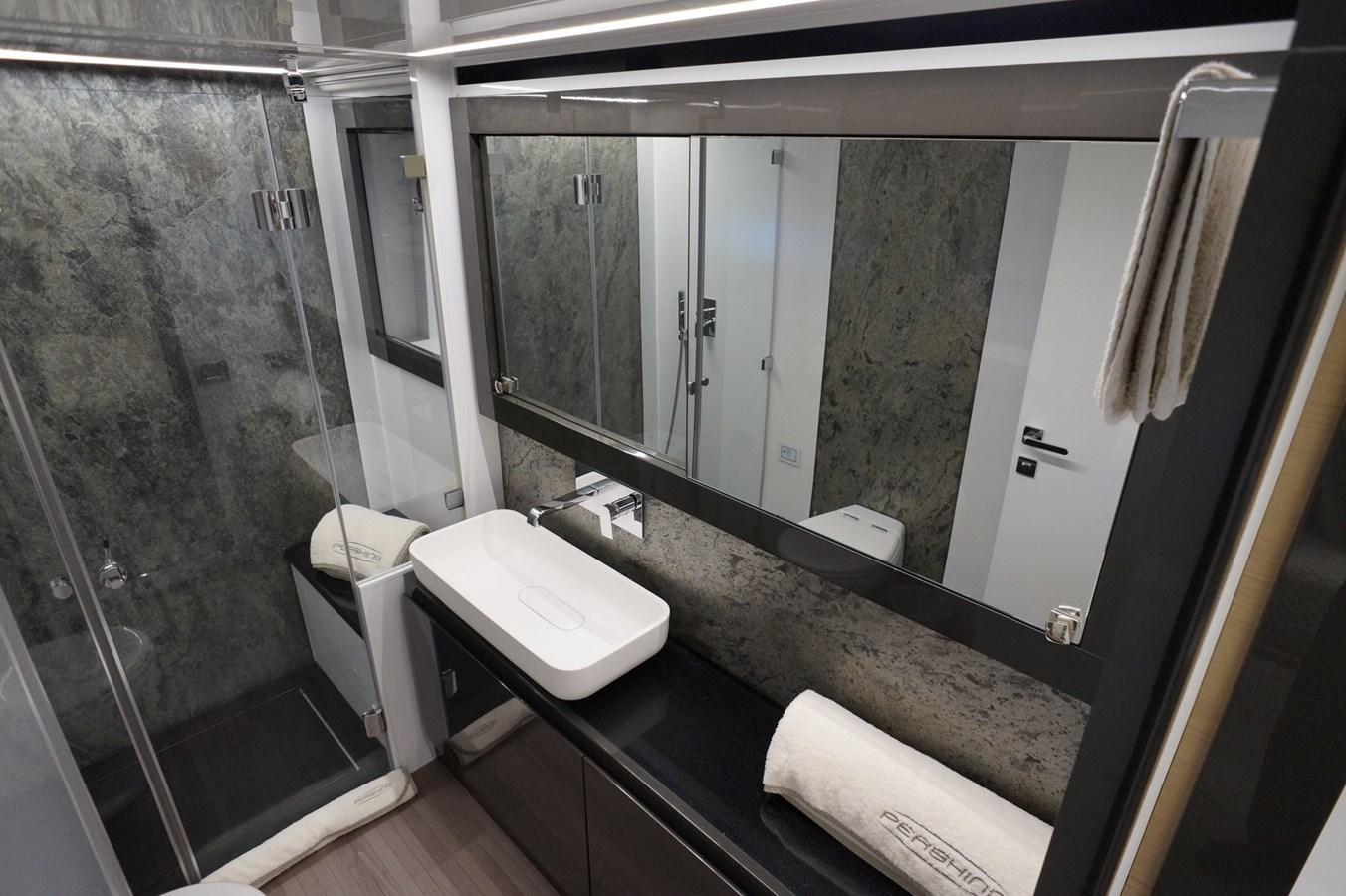 a bathroom with a large mirror aboard THE OFFICE Yacht for Sale