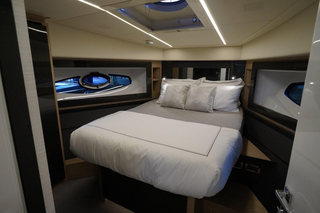 a bed in a room aboard THE OFFICE Yacht for Sale