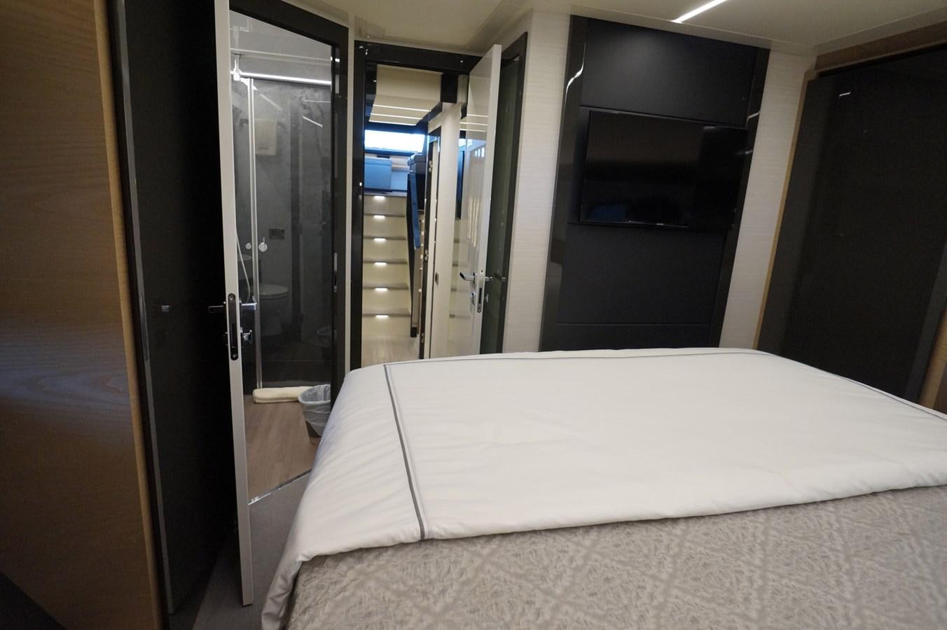a bed in a room aboard THE OFFICE Yacht for Sale