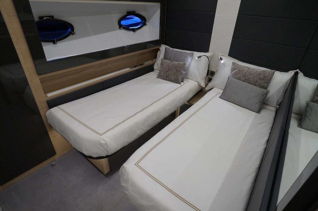 a couple of beds in a room aboard THE OFFICE Yacht for Sale