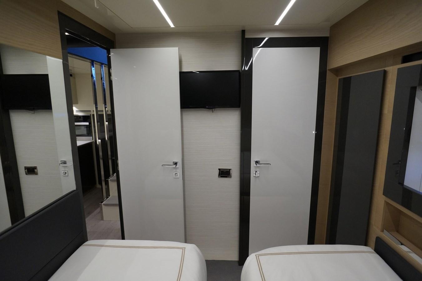 a room with a door and a table with chairs aboard THE OFFICE Yacht for Sale