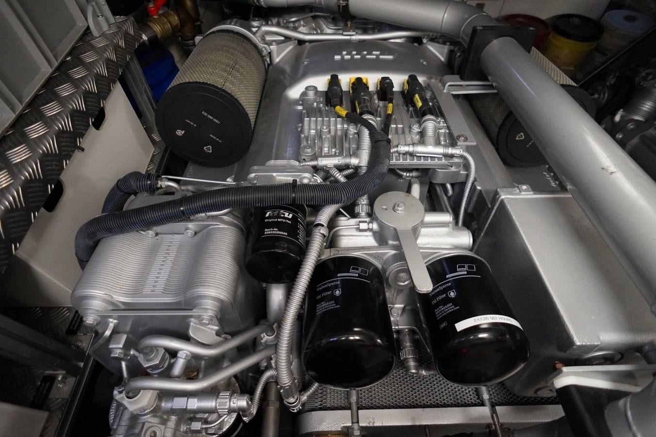 a close-up of a car engine aboard THE OFFICE Yacht for Sale