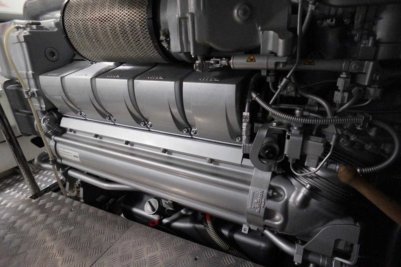 a close-up of a car engine aboard THE OFFICE Yacht for Sale