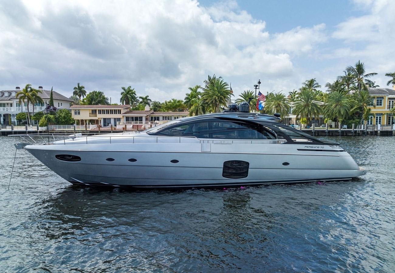 a white yacht in a body of water aboard LIQUID Yacht for Sale