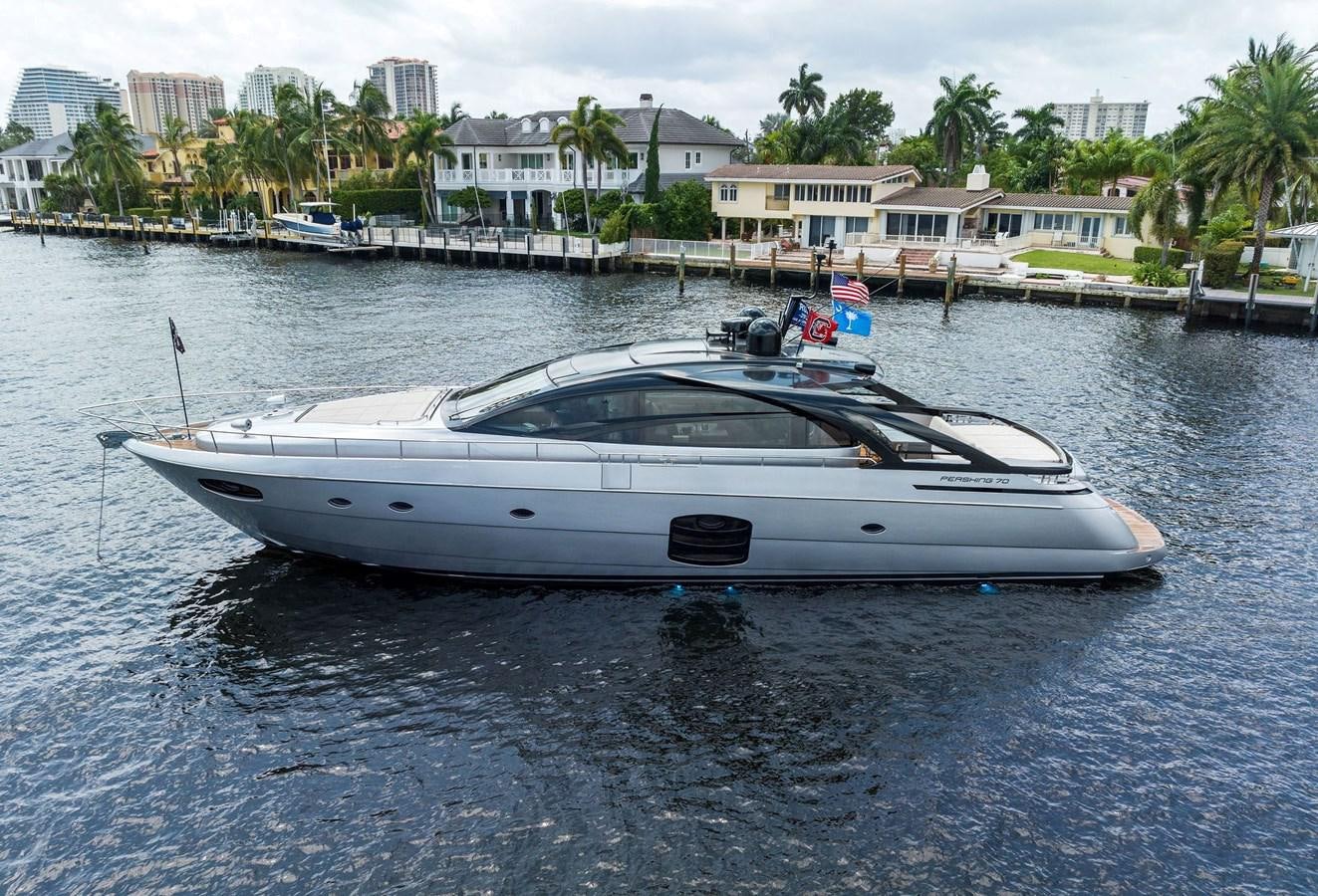 a white boat in the water aboard LIQUID Yacht for Sale
