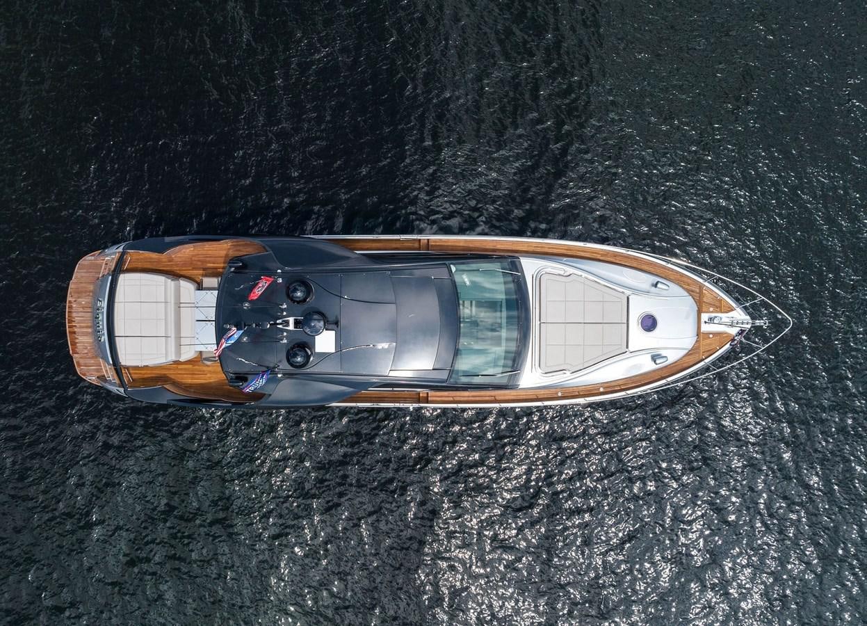 a small boat on the water aboard LIQUID Yacht for Sale
