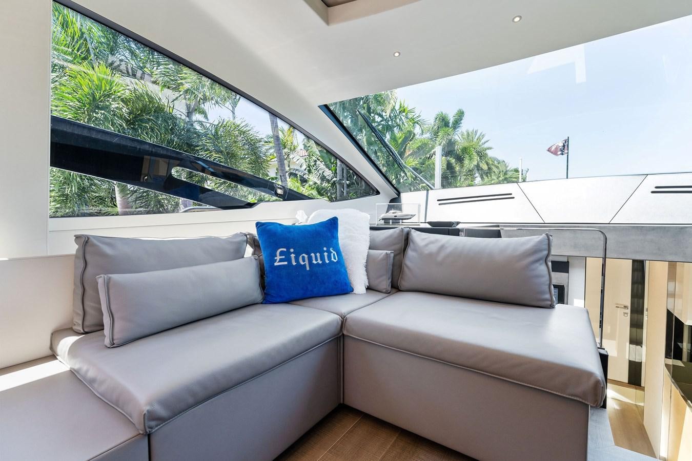 a couch in a room aboard LIQUID Yacht for Sale